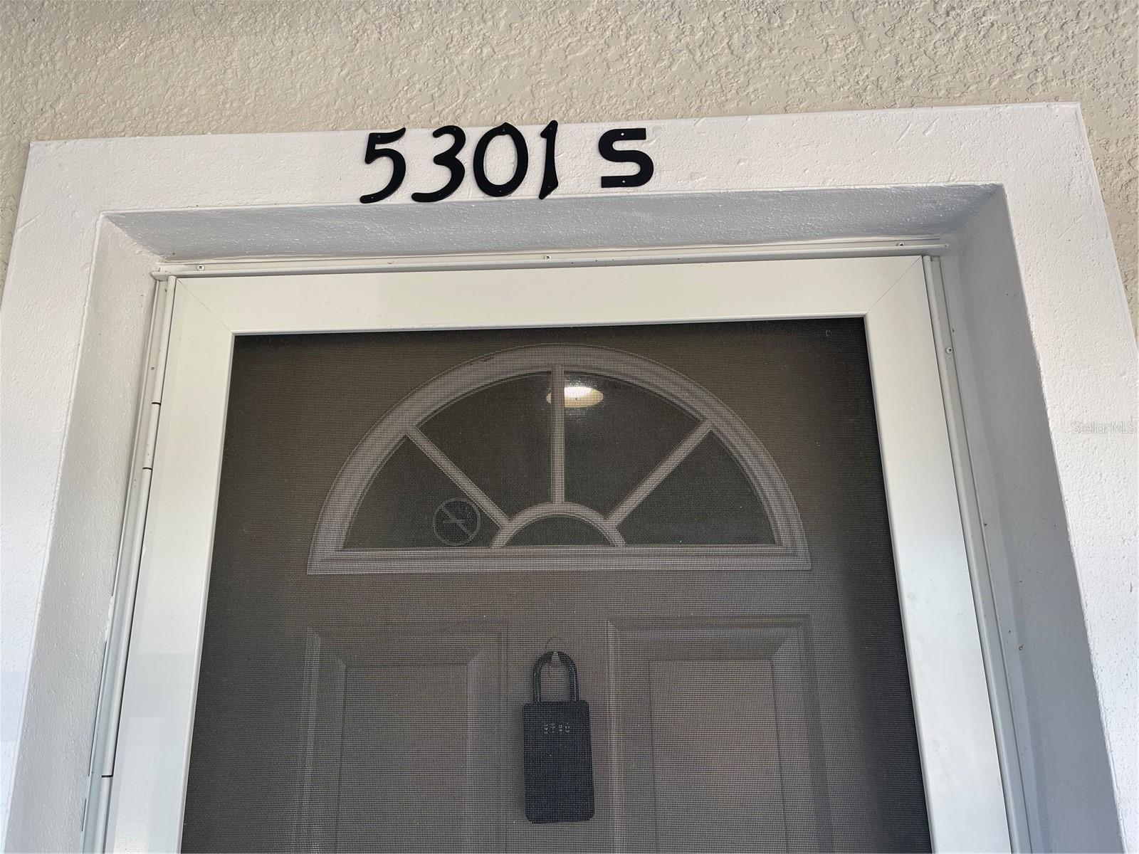 Screen door at studio entrance