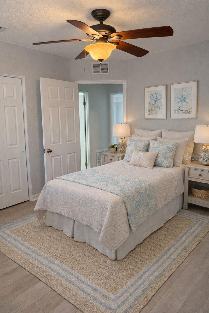 The second bedroom has lovely vinyl flooring and is spacious!  (Photo has been virtually staged to illustrate the potential use of the space).