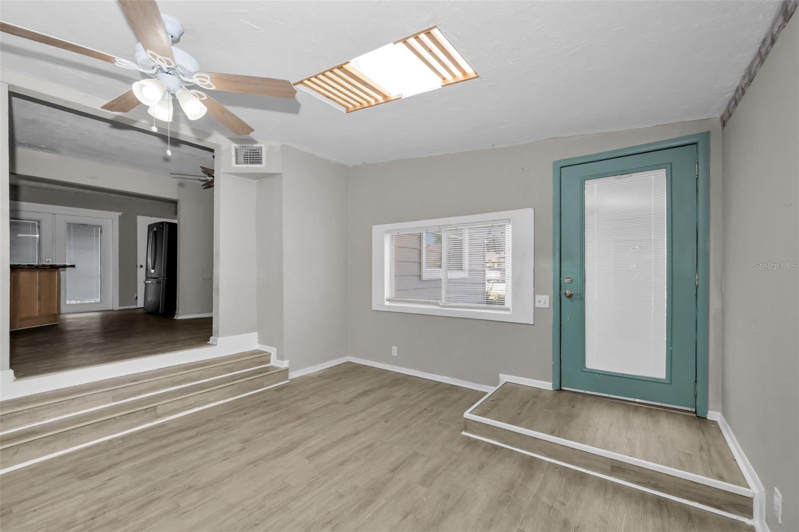 Enter this charming, light and bright home with skylights & decorative fireplace.