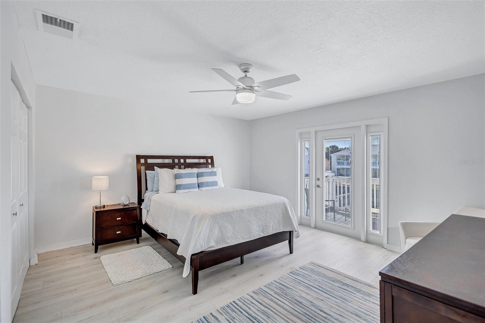 Primary Bedroom with Private Balcony overlooking the water