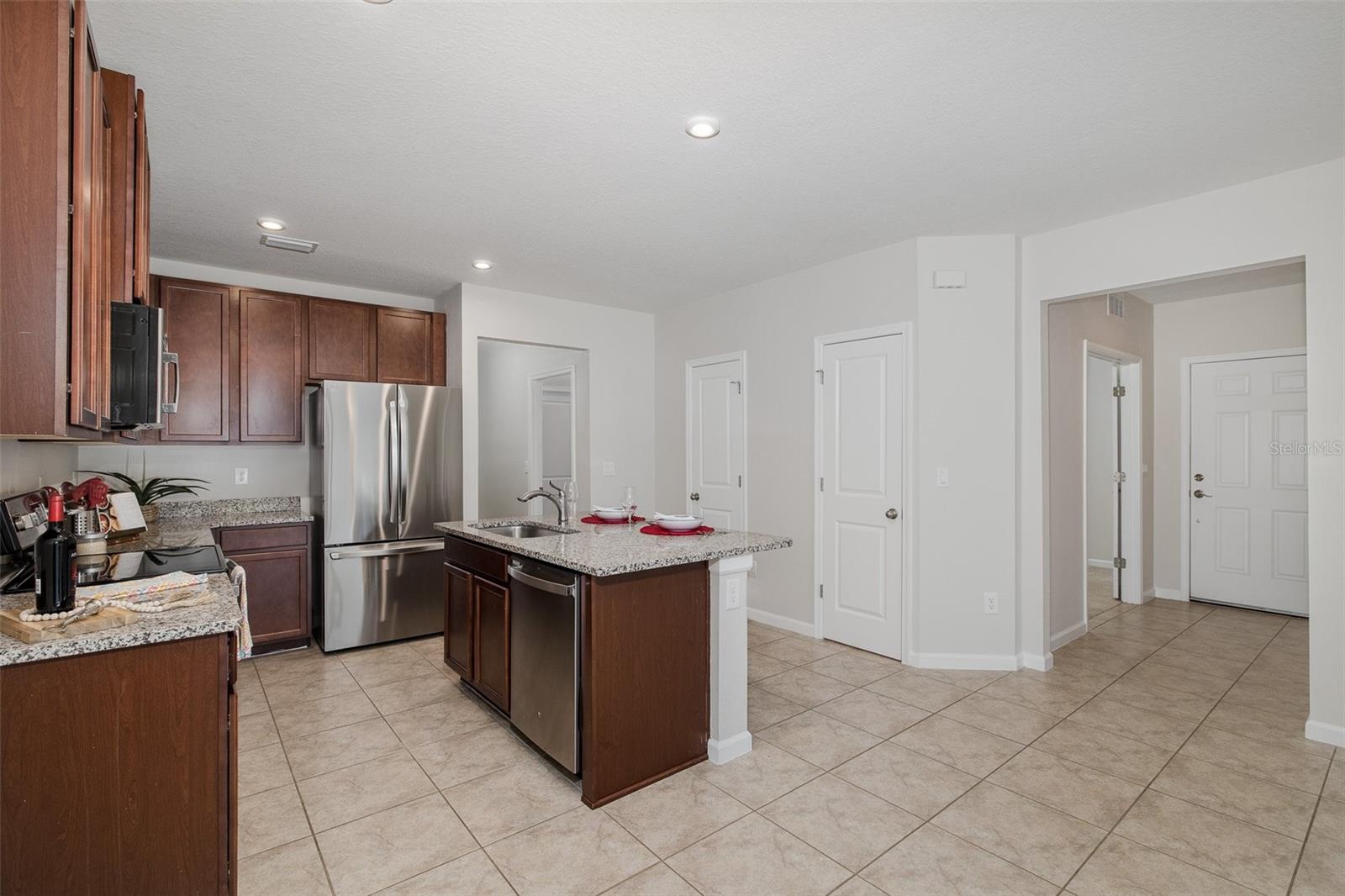 Kitchen looking toward entry way and 3rd bedroom/office