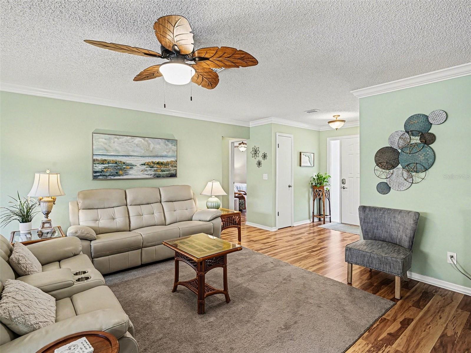 Living room looking toward foyer and front door