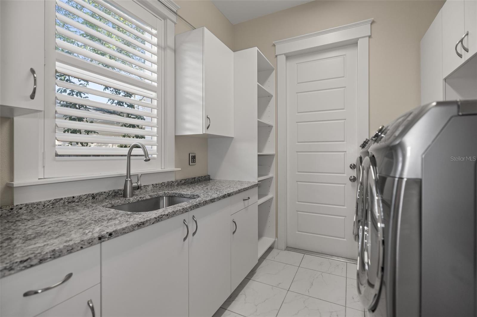 Laundry Room with Sink and Ample Cabinetry