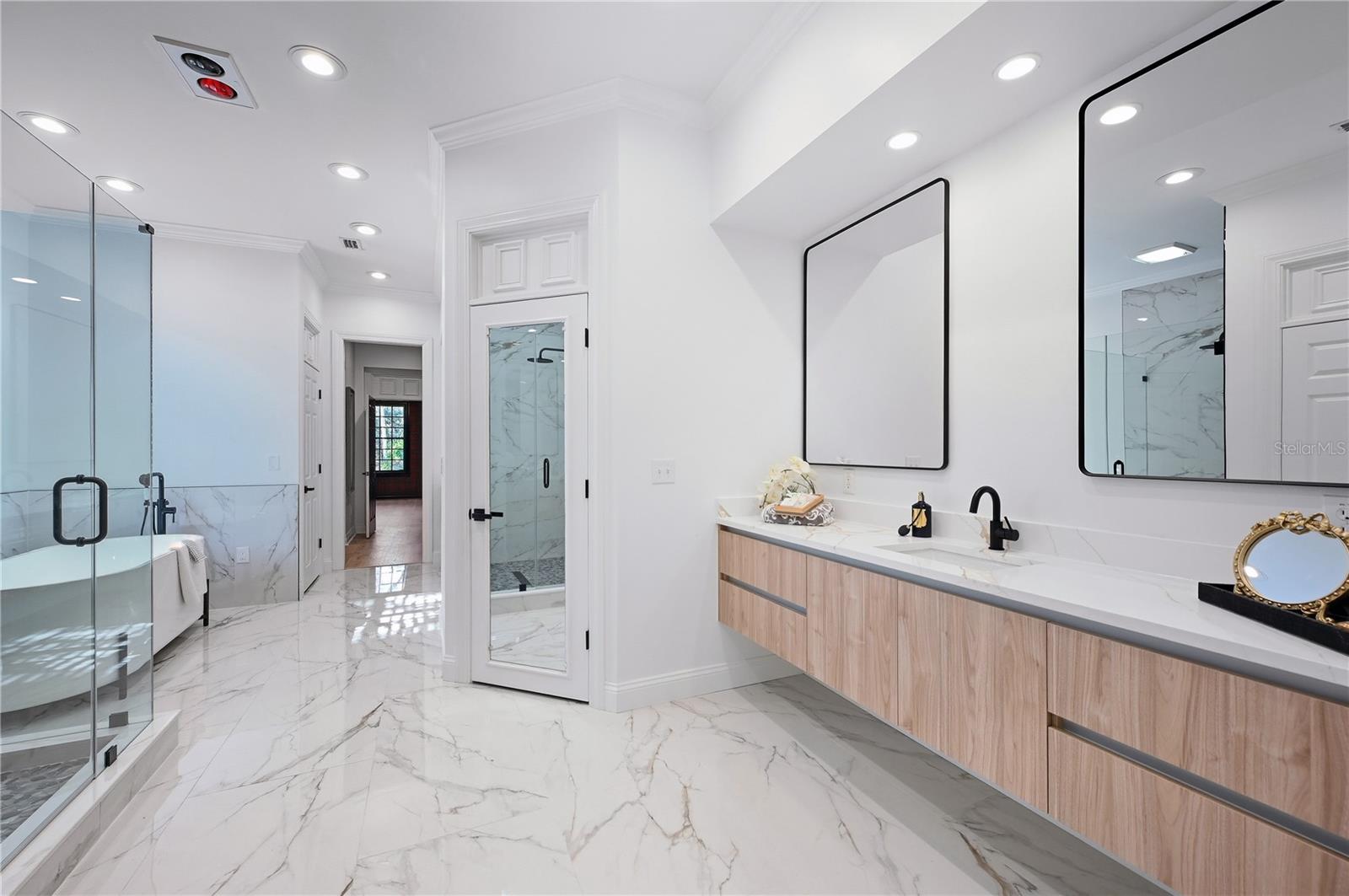 Spa-inspired Master bath. with dual sinks, NEW everything! Cedar closet, his and hers toilet area with bidet! His and hers closets too.