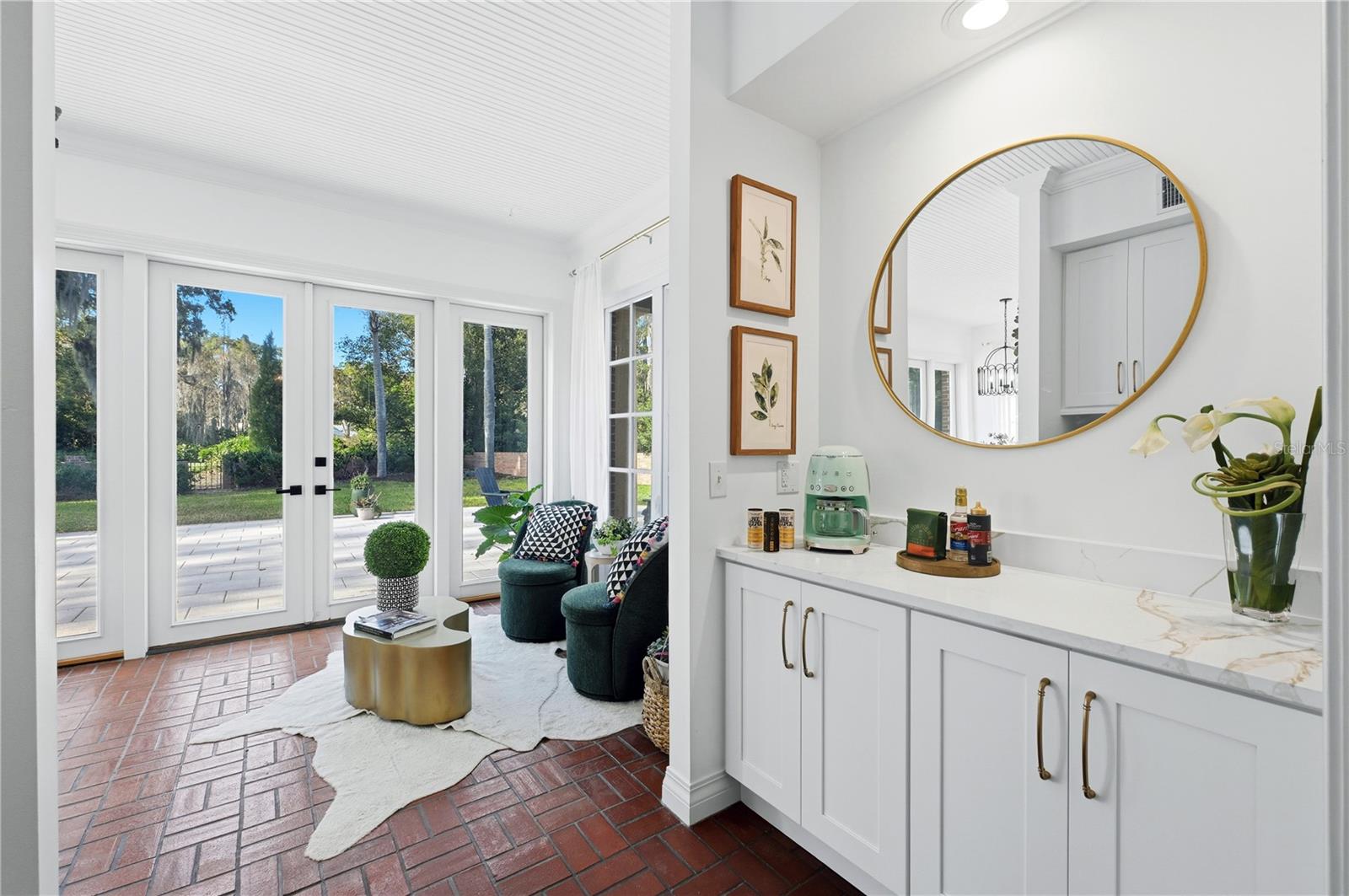 Light and bright sunroom with golf course views and privacy. Rare combination!