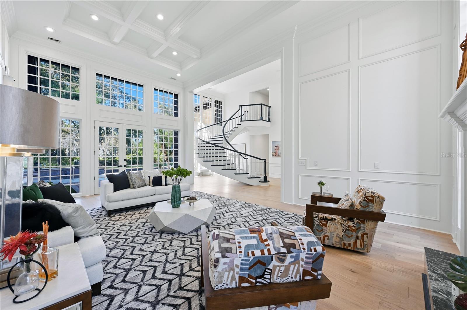 WOW room. Just off the grand entry and curved staircase. Formal living room with 2 story ceilings and floor to ceiling windows greet you to this exquisite luxury estate!
