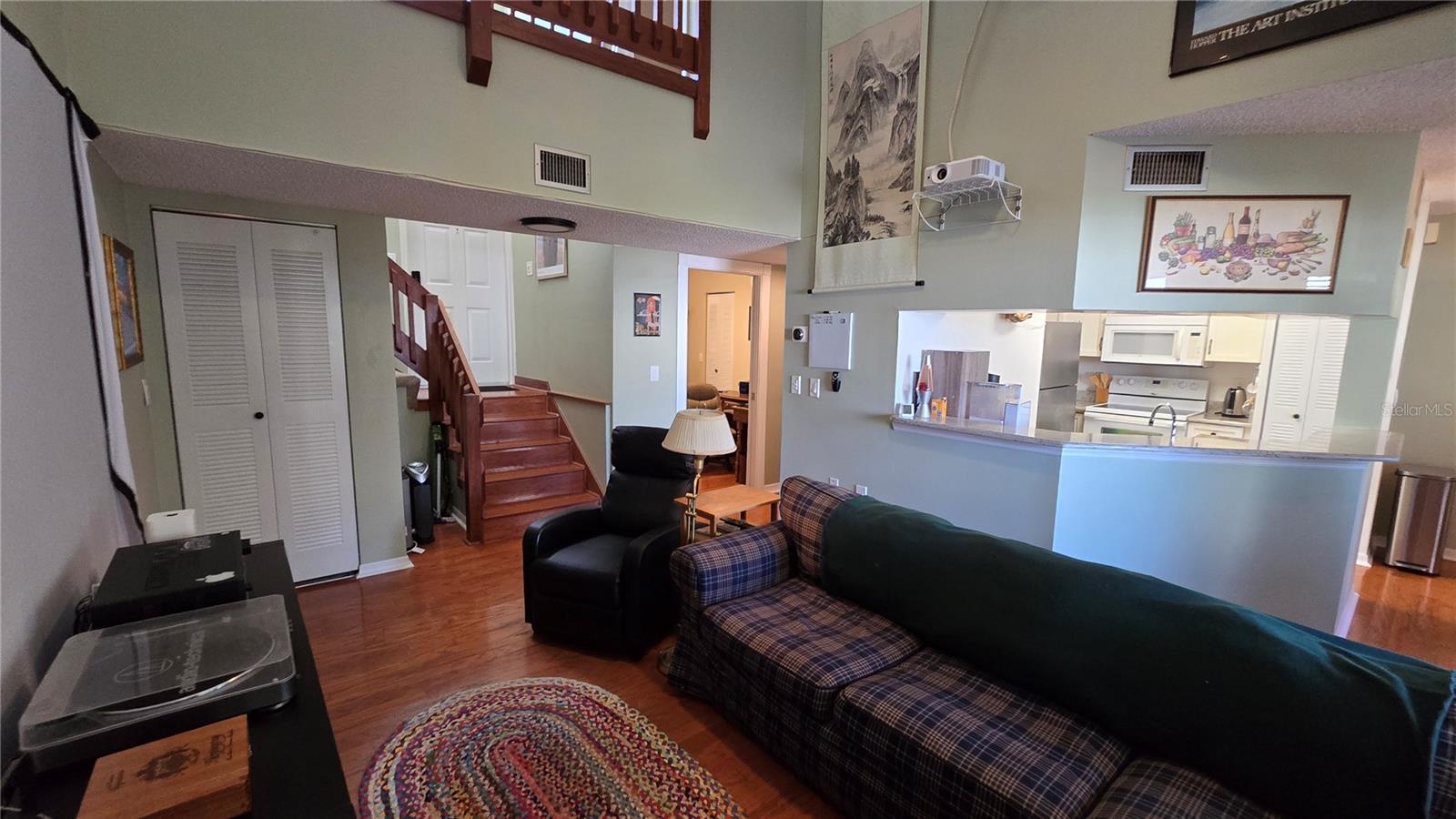 Open concept living room with high ceilings