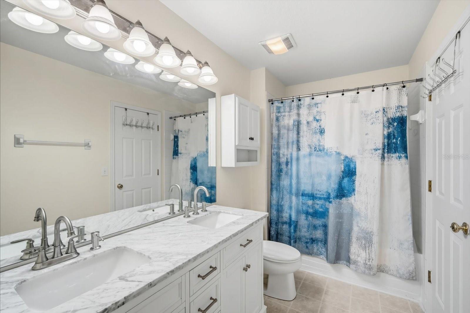 Master bathroom upstairs and accessible through hall as well.