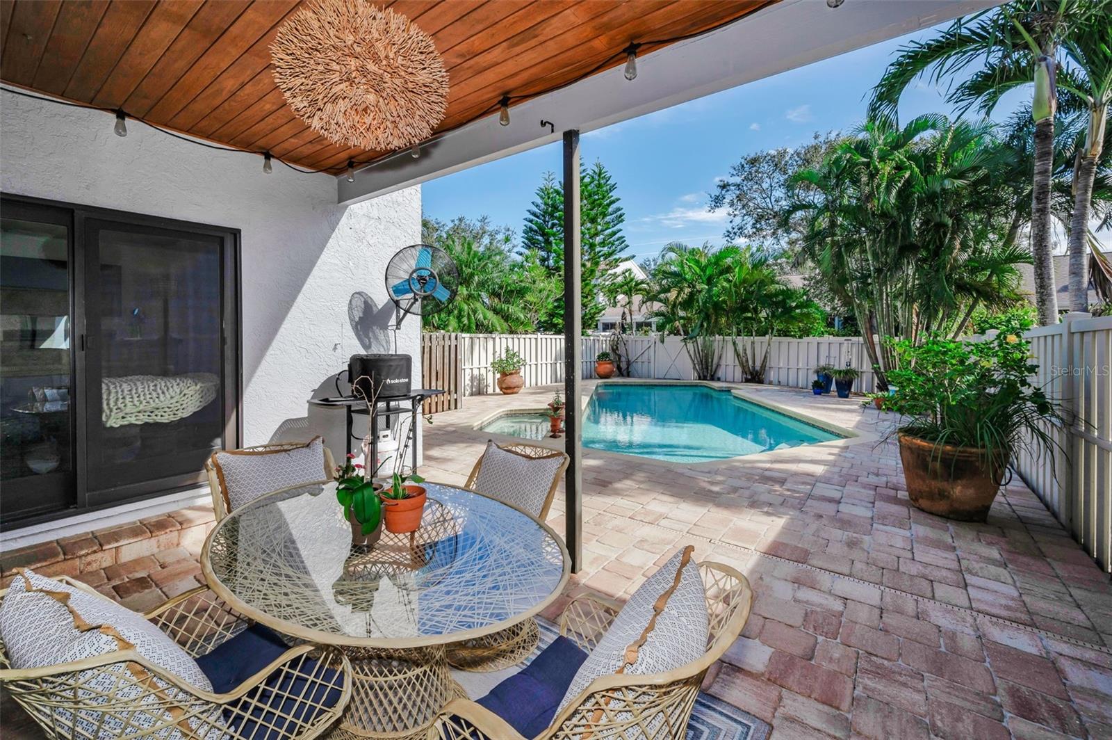 Covered patio area with views of the pool