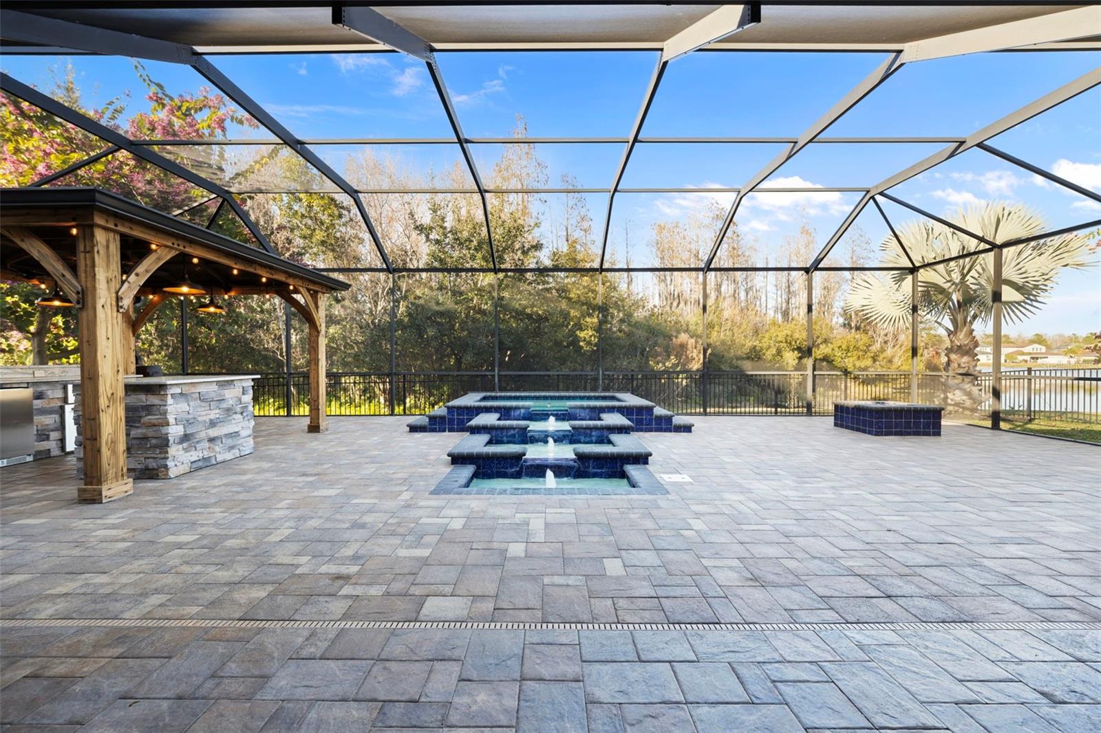 Custom multi-level fountain with waterfall - gas heated pool and color LED lights with remote control.