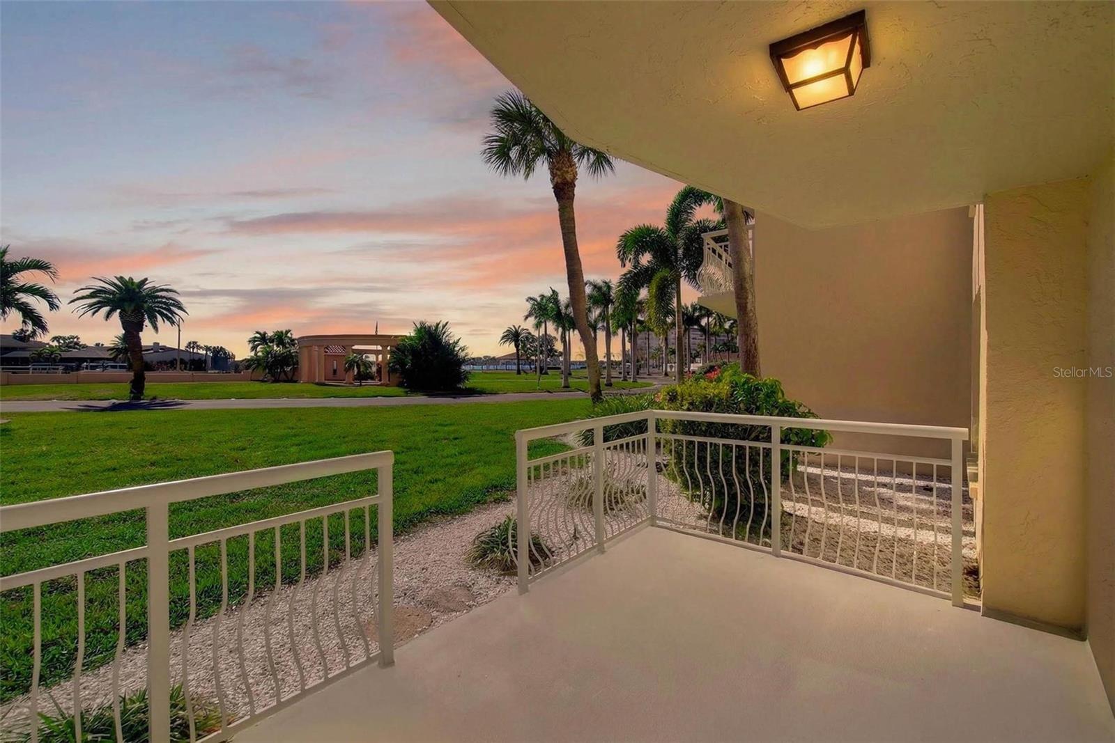 Unwind on your private patio while taking in spectacular sunsets over Boca Ciega Bay.