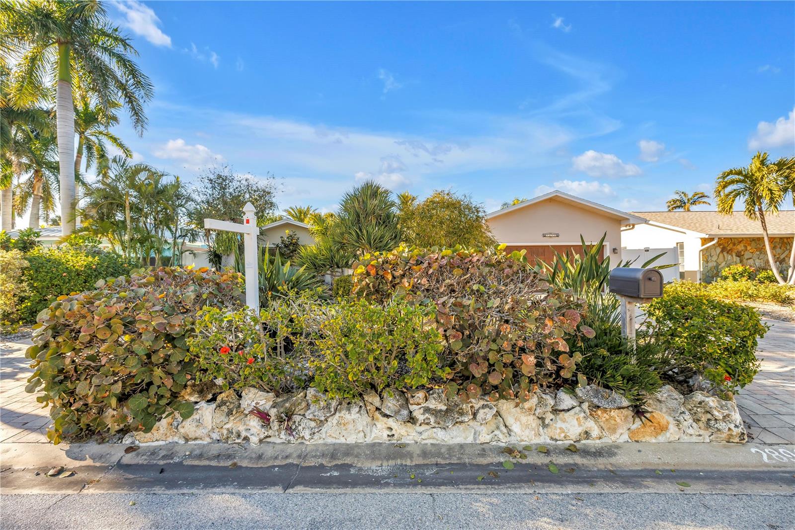 Front yard pavers and lush landscaping