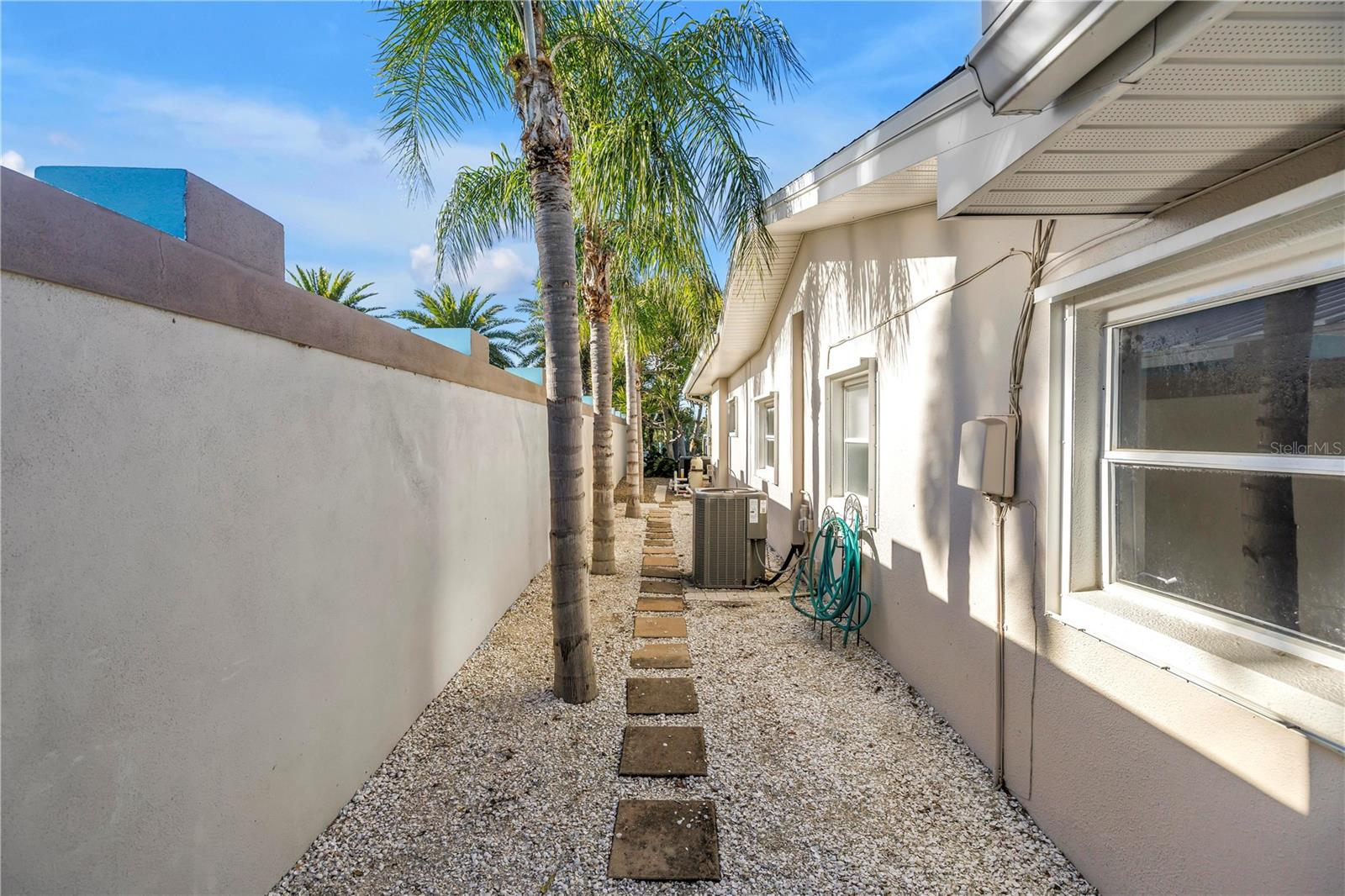 Left side of house - gated side entry leading to backyard