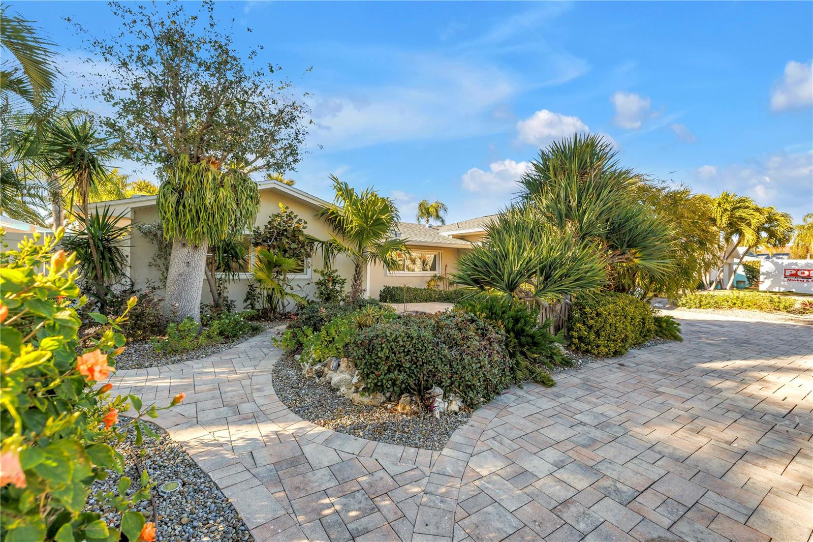 Front yard pavers and lush landscaping