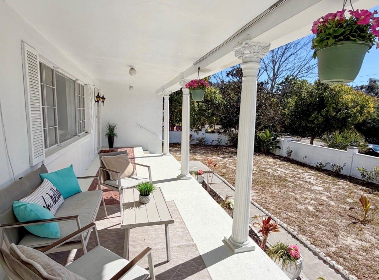 One of the most inviting features is the open front porch with classic Greek columns