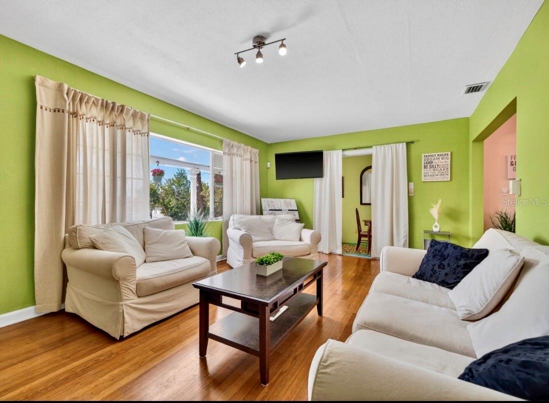 Inside, you’ll find original hardwood floors throughout, adding warmth and timeless character.