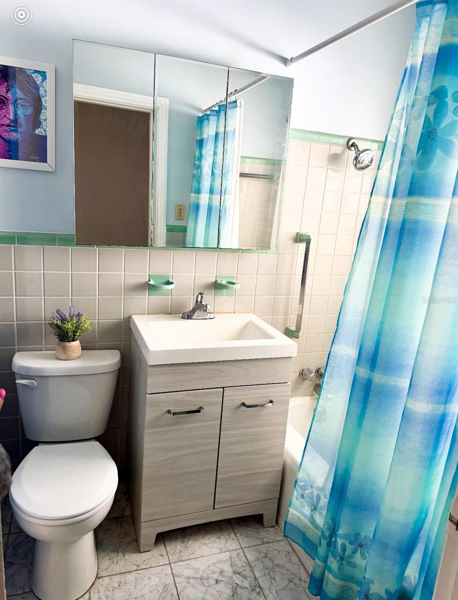 Bathroom has a marble flooring