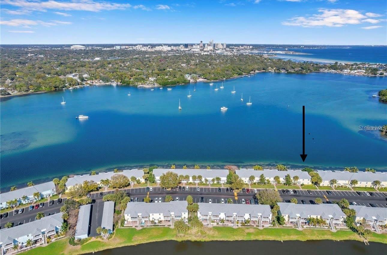Drone View north, with arrow pointing to condo