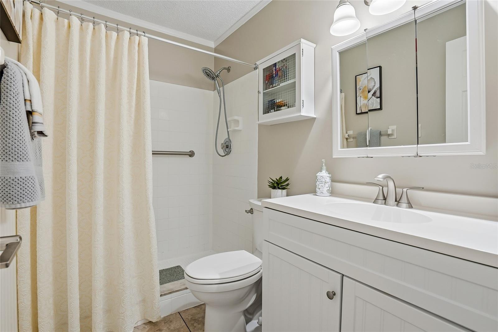 Primary bathroom with step in shower.