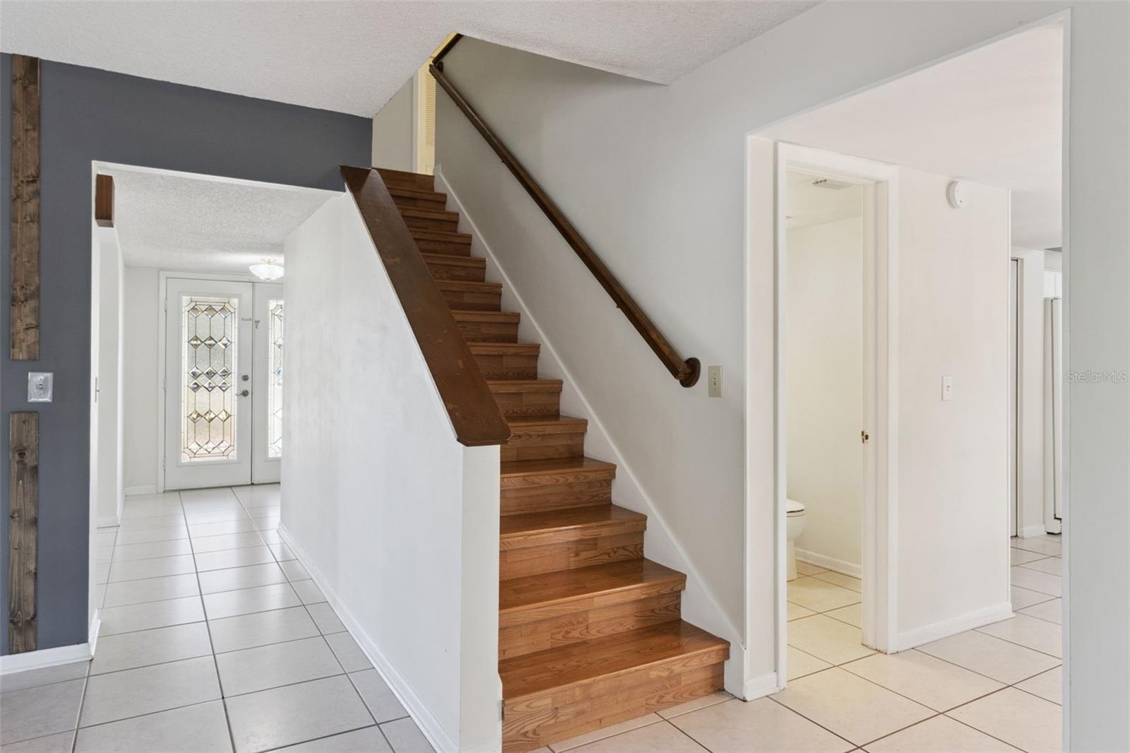 View inside the family room looking toward stairs to the 2nd level.