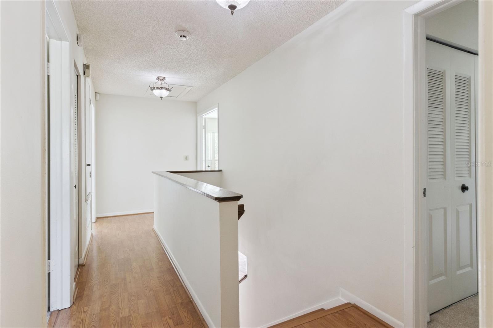 Second floor hallway looking toward the back bedrooms.