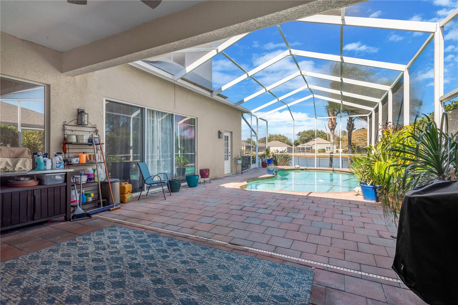 Covered porch and screen enclosure over pool