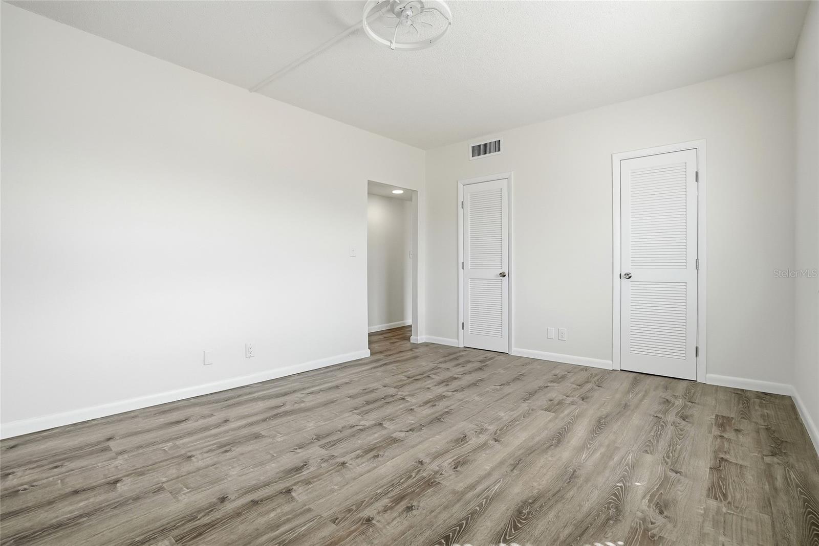 Primary Bedroom- behind those doors is a large walk in closet.