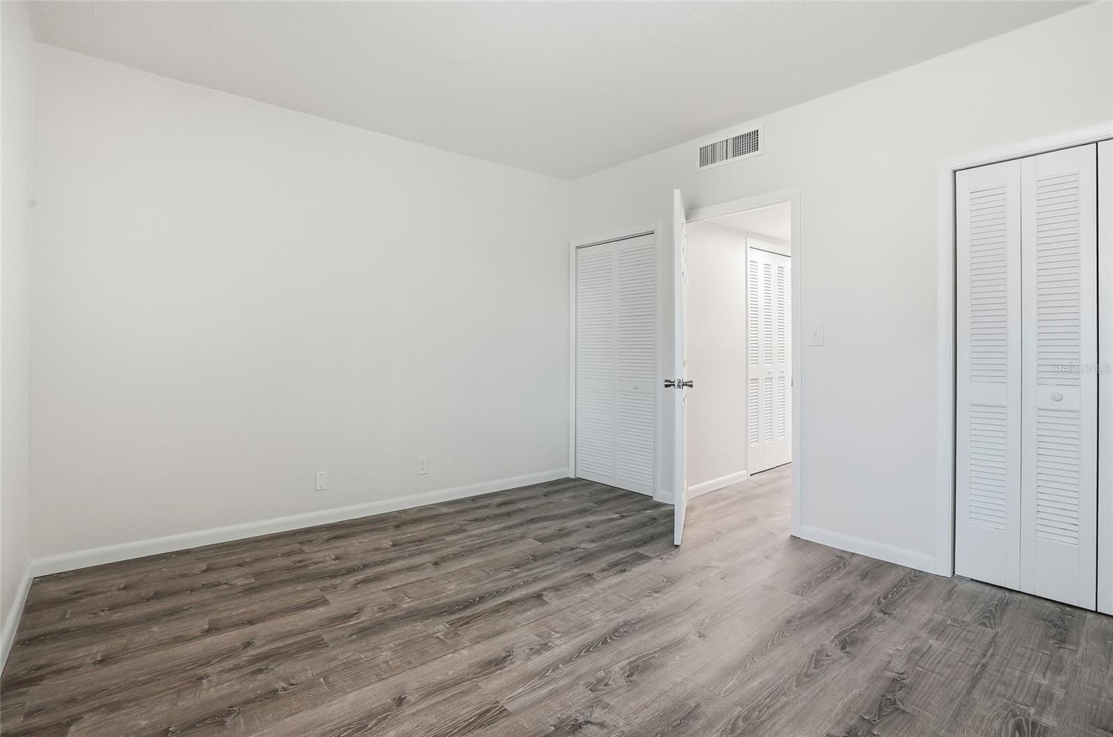 Second bedroom with extra storage space with two closets.