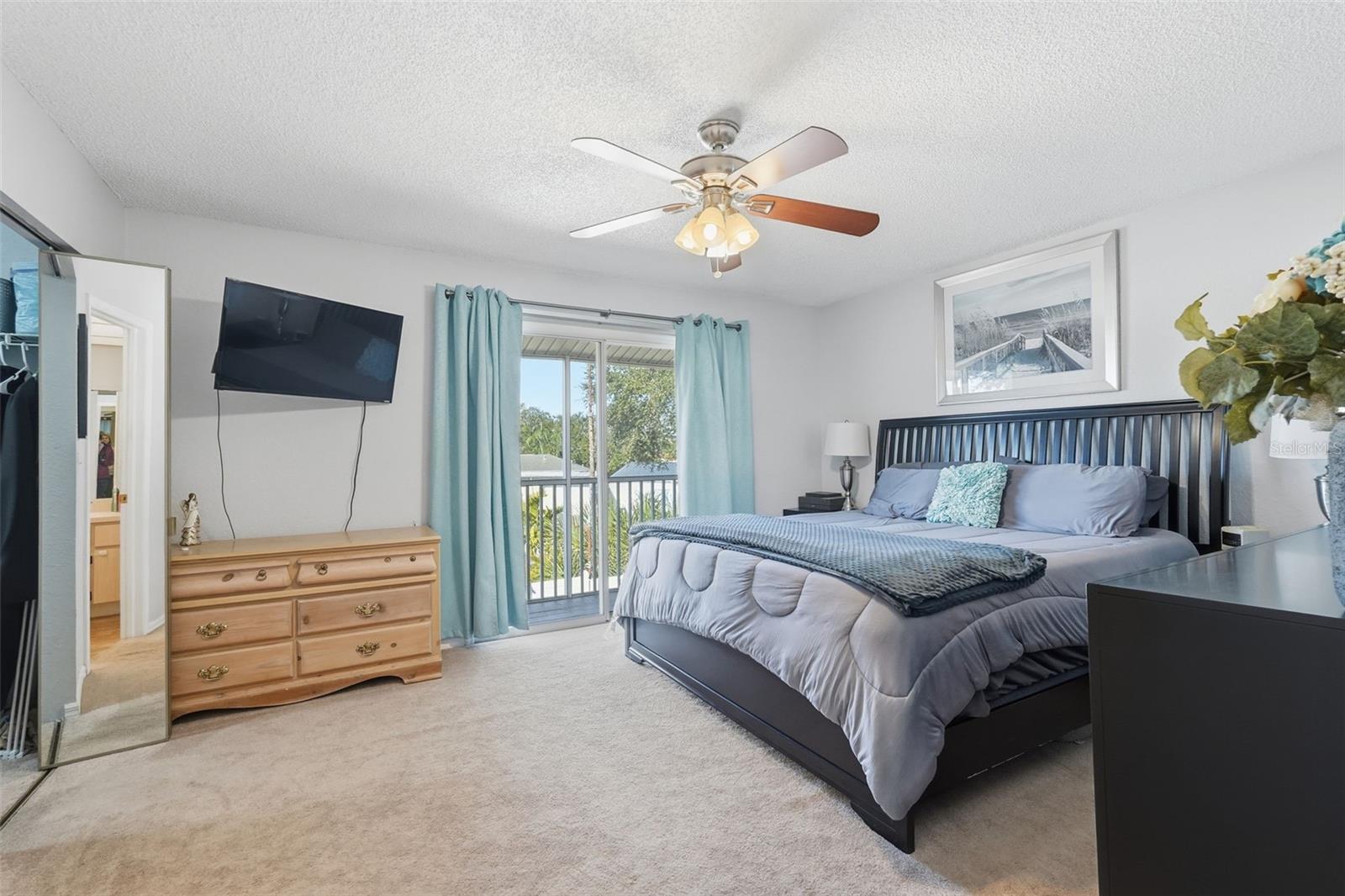 Master bedroom with a balcony