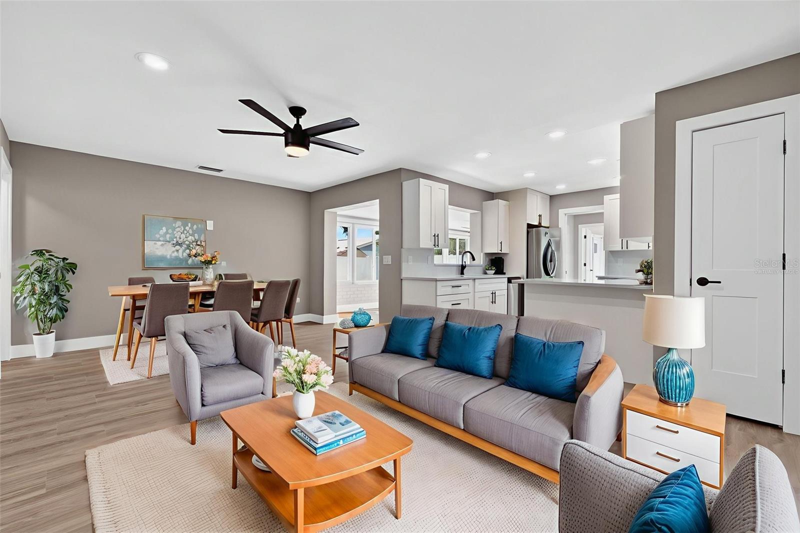 Virtually staged.  Example of how the furniture could be set up for you.