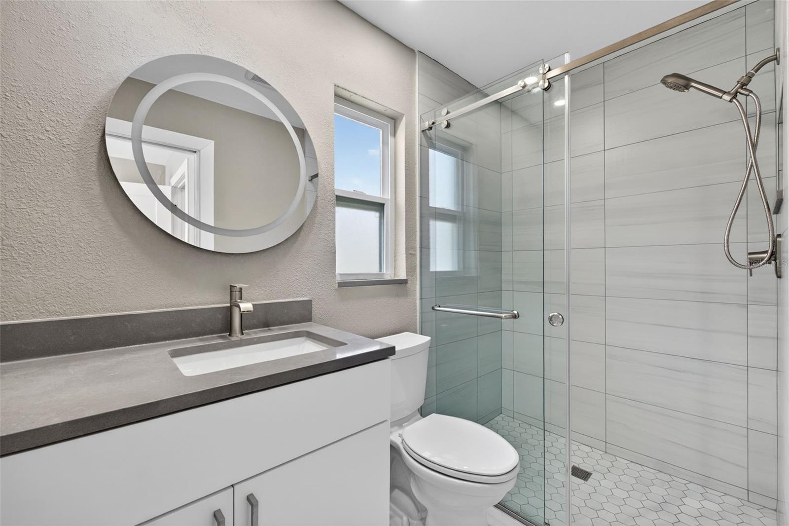 COmpletely updated full bathrooms with new showers and vanities.