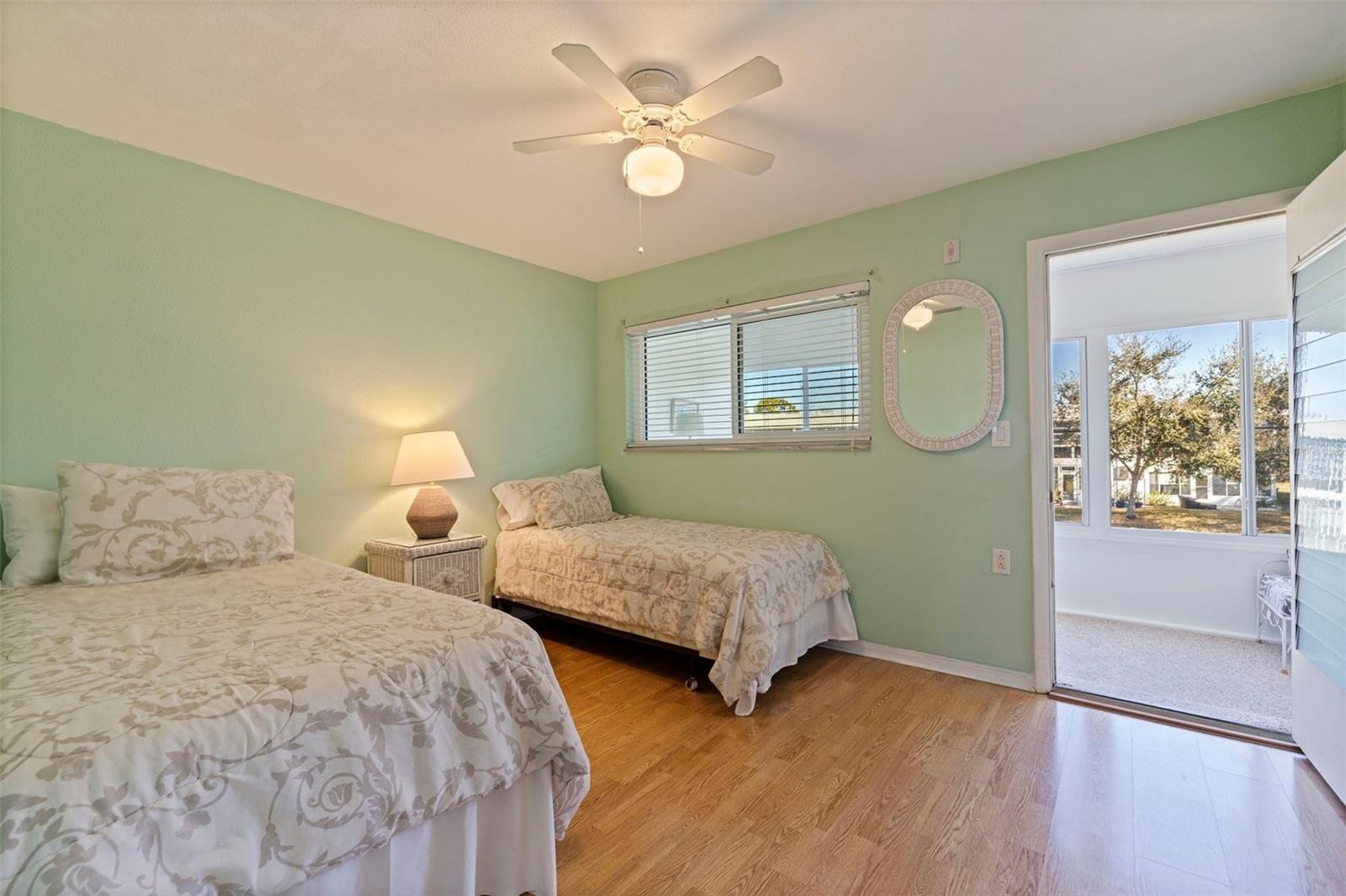 Primary Bedroom with view on enclosed porch