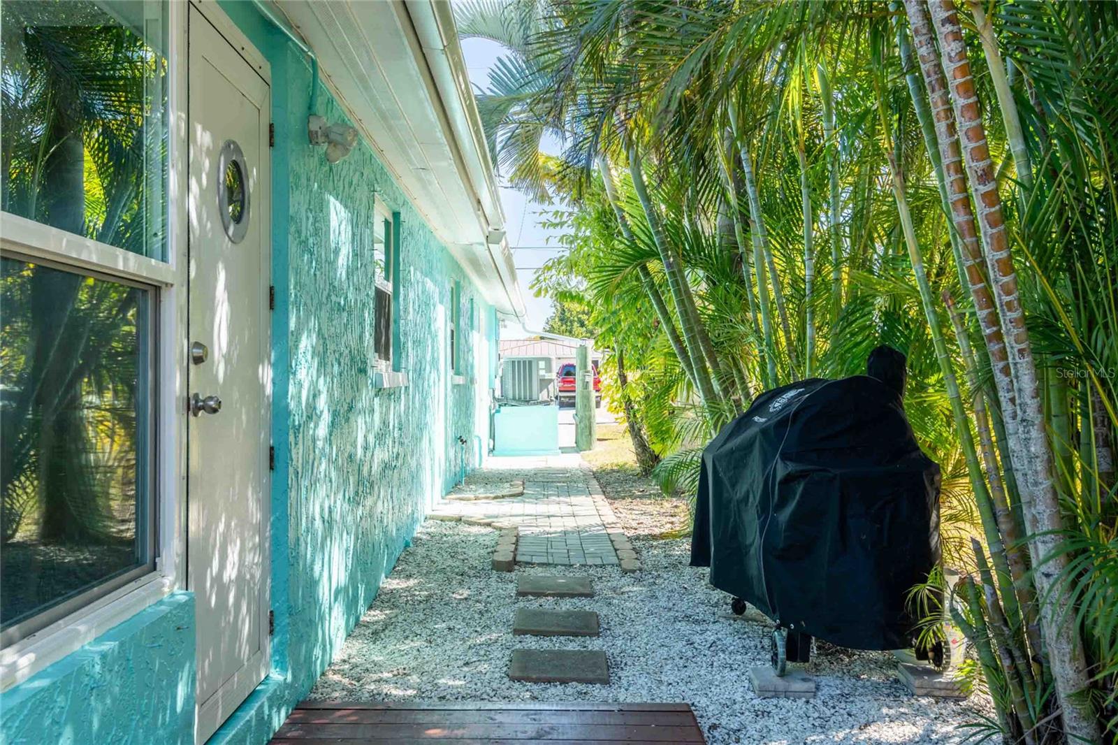 Side of home with door to kitchen.