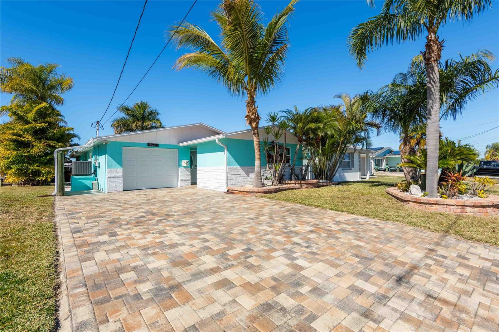 Renovated 3 bedroom, 2 bath home with a boat dock located on a canal with gulf access and a backyard oasis!