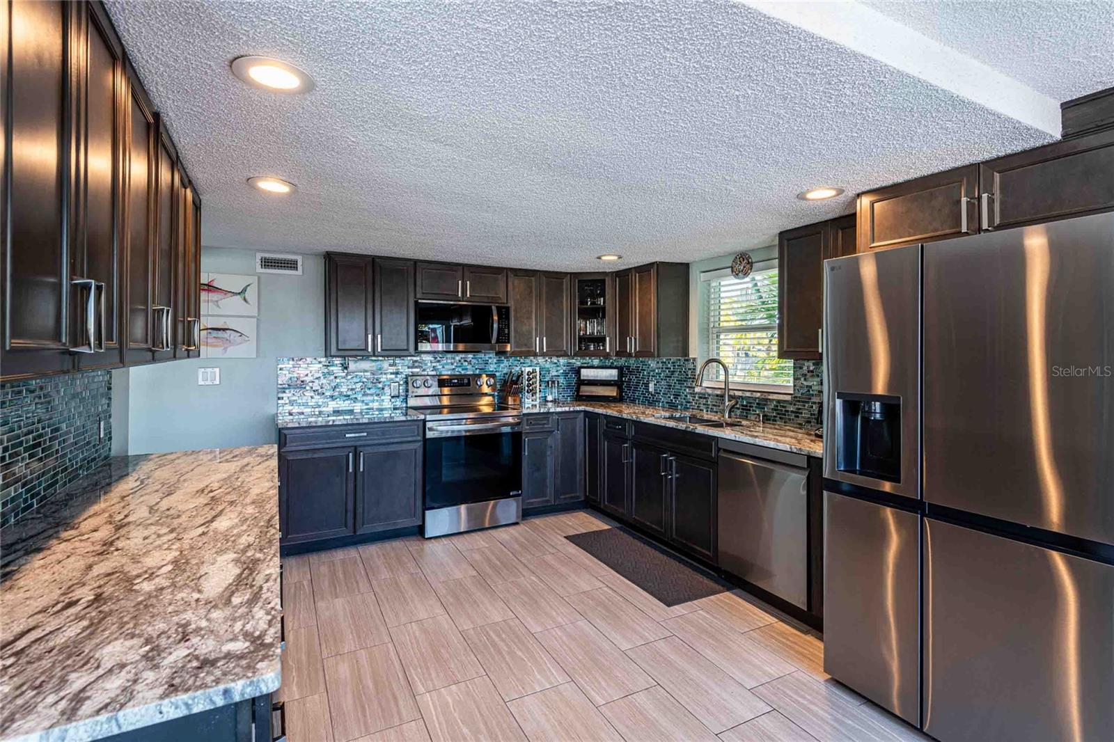 Kitchen features solid wood, soft close cabinets and drawers, newer LG appliances.