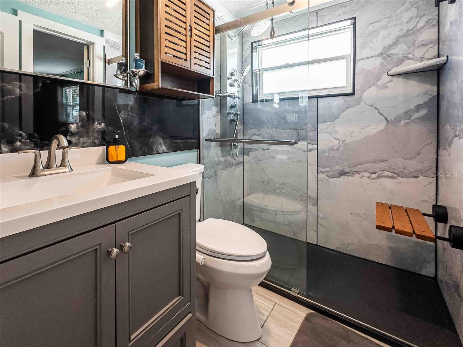 Shower with bench that folds up.