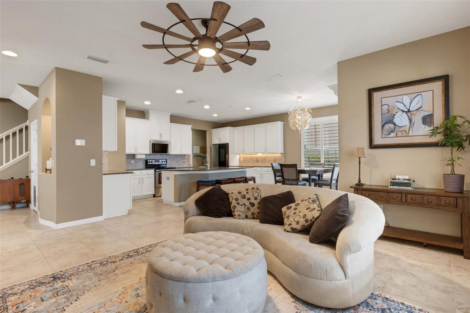 Living room with views of back yard pool oasis and pond.