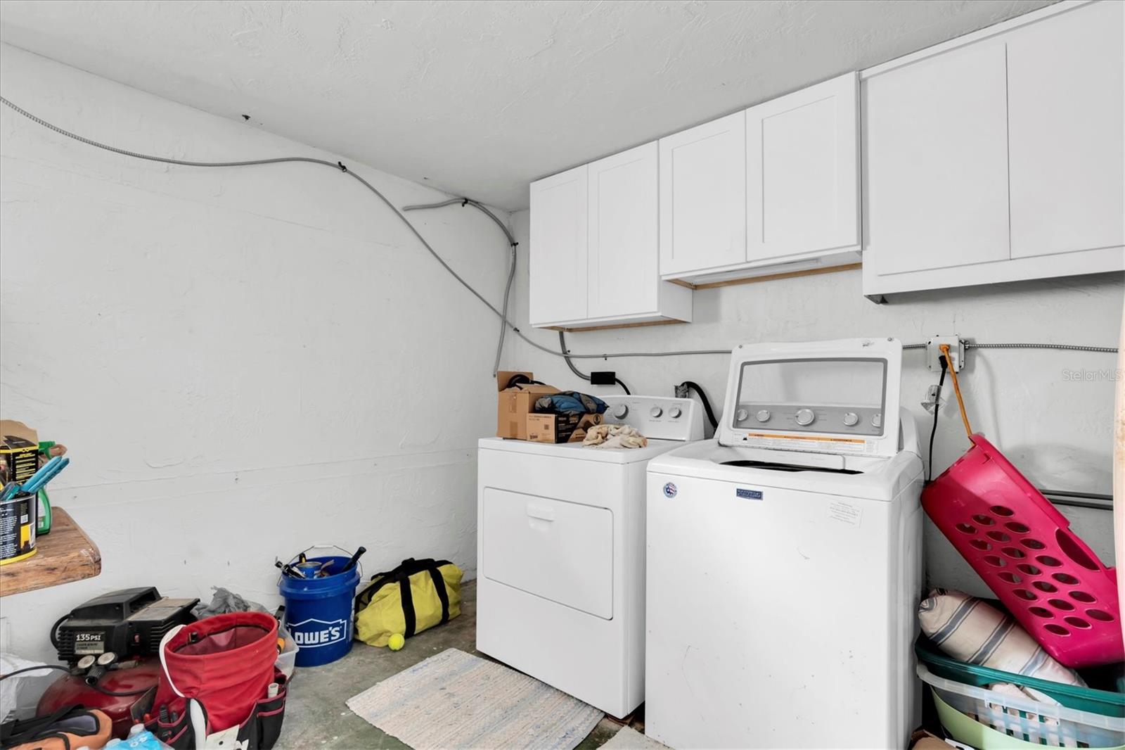 Laundry area located in the garage. Washer & Dryer