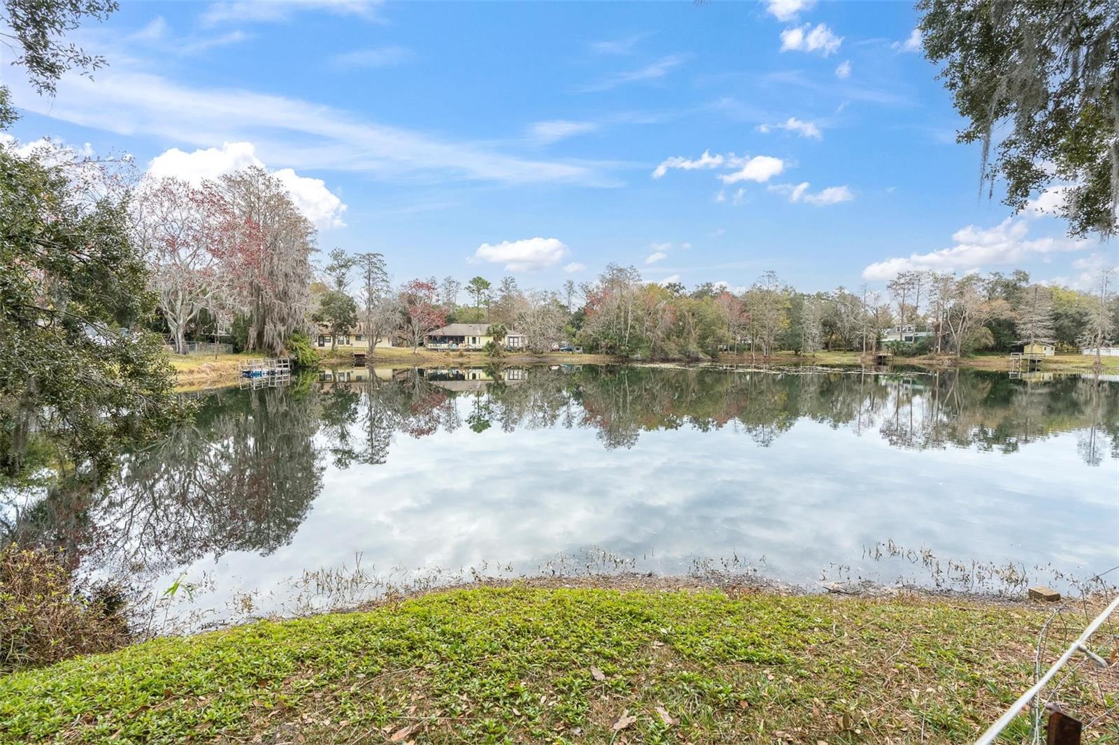 Lake view with the neighboring homes.