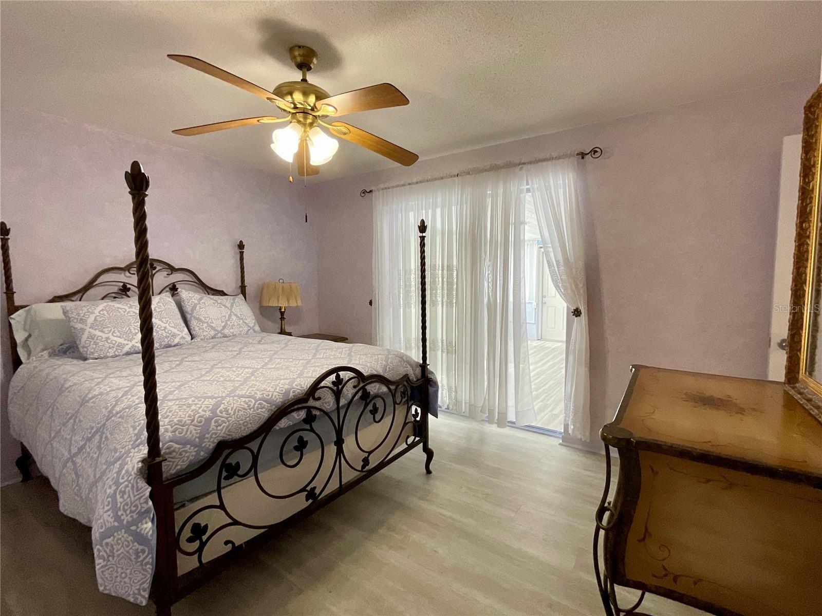 19-Primary bedroom view of slider to family room