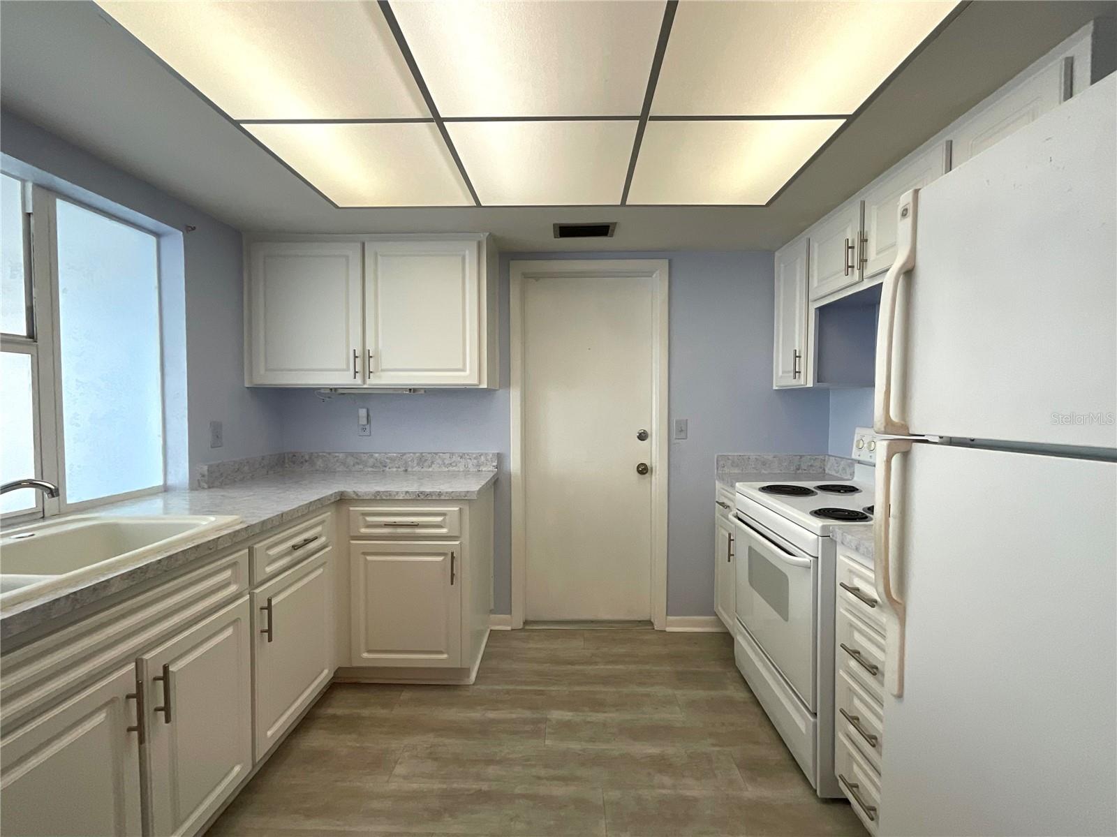 12-Kitchen view with door to laundry area in garage