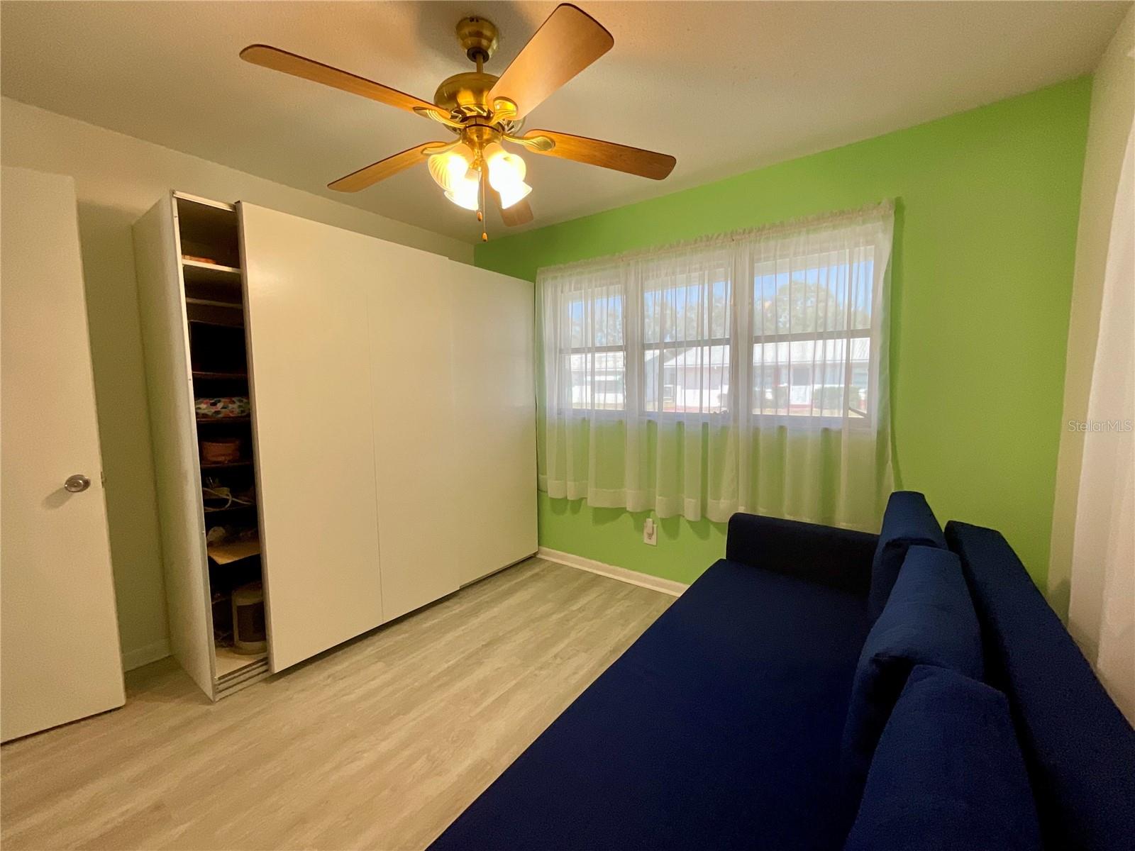25-Guest bedroom with addition storage cabinet.