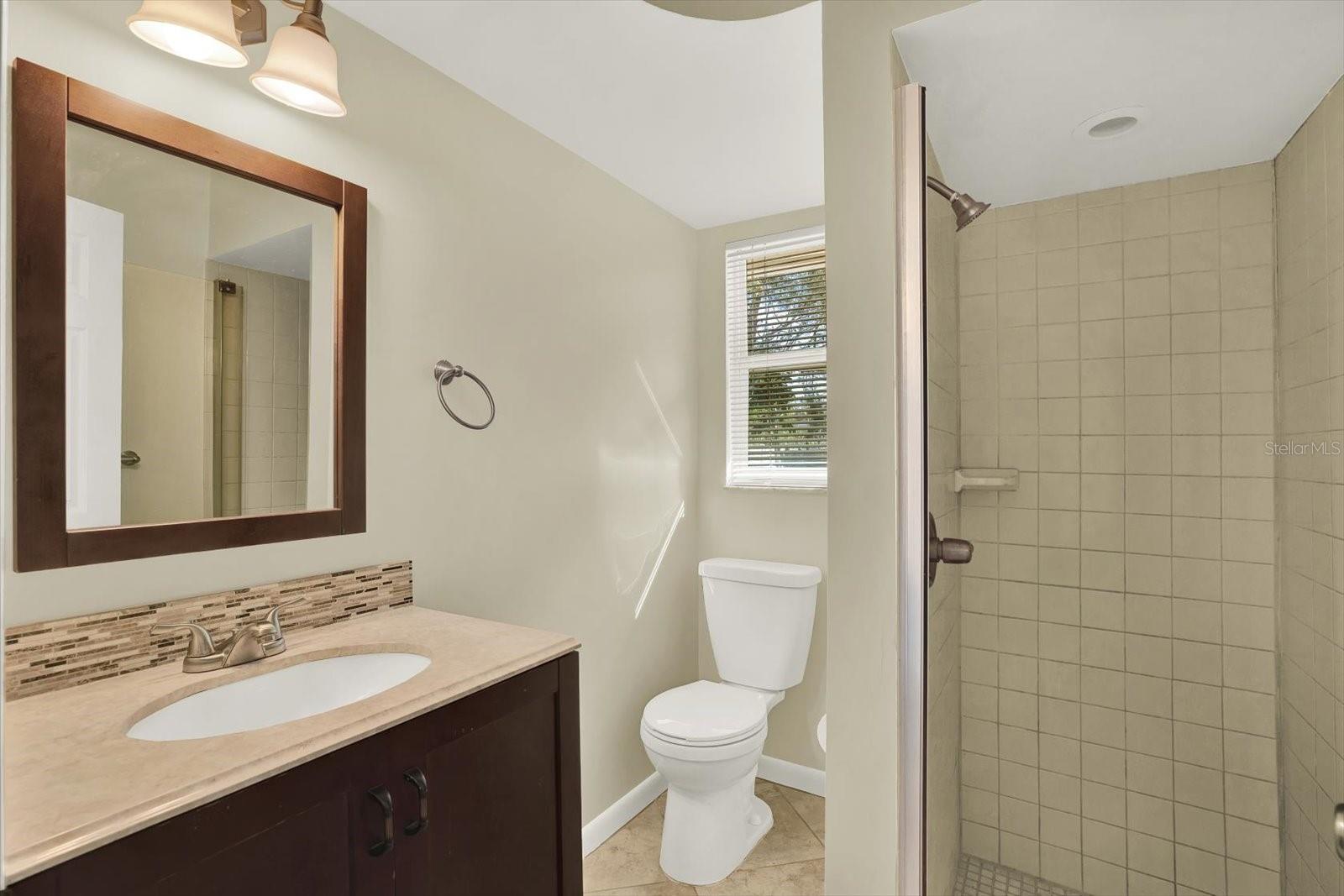 Secondary bath with shower.