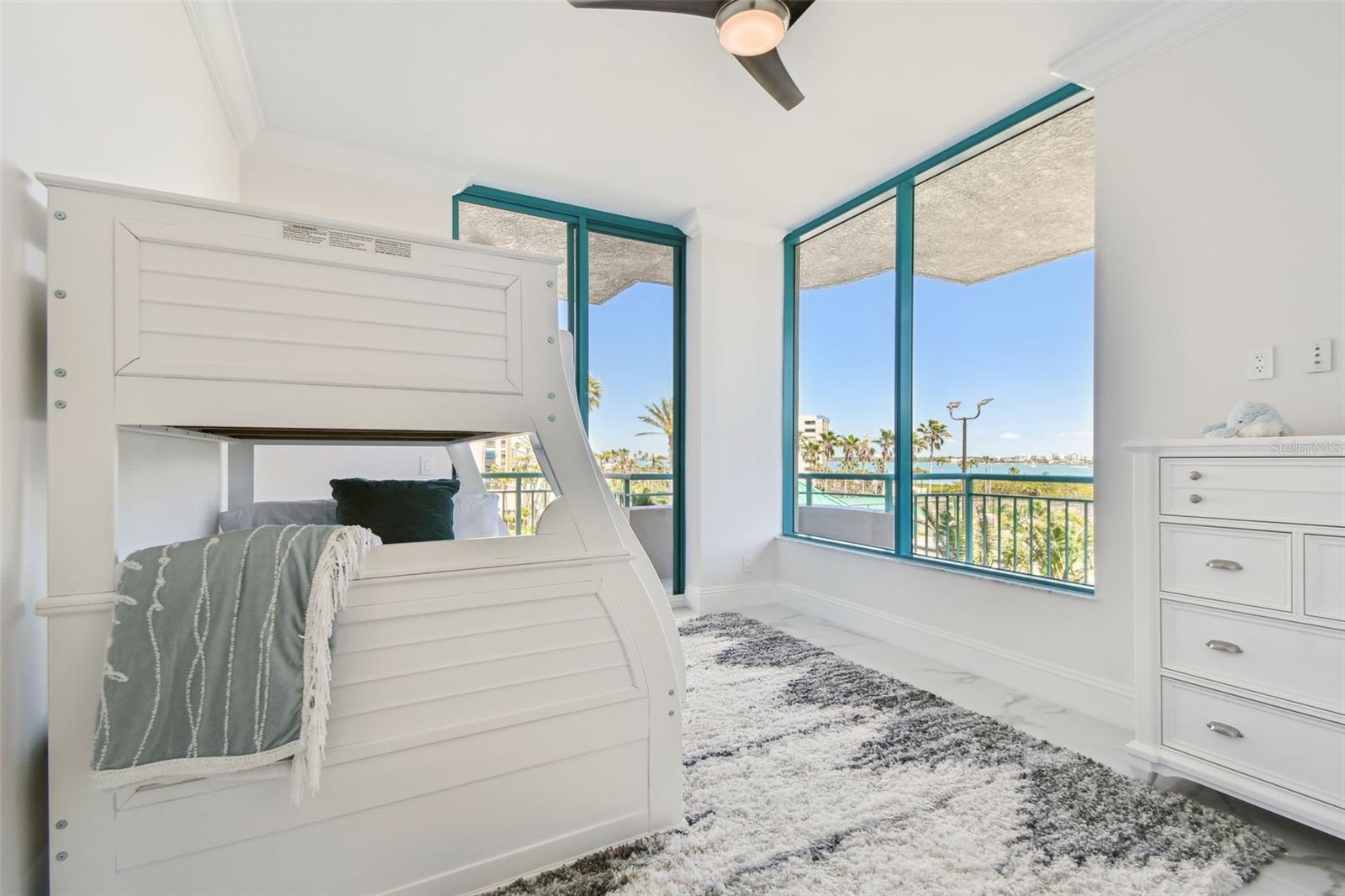 Bedroom 4 with views of city, pool & partial Gulf view