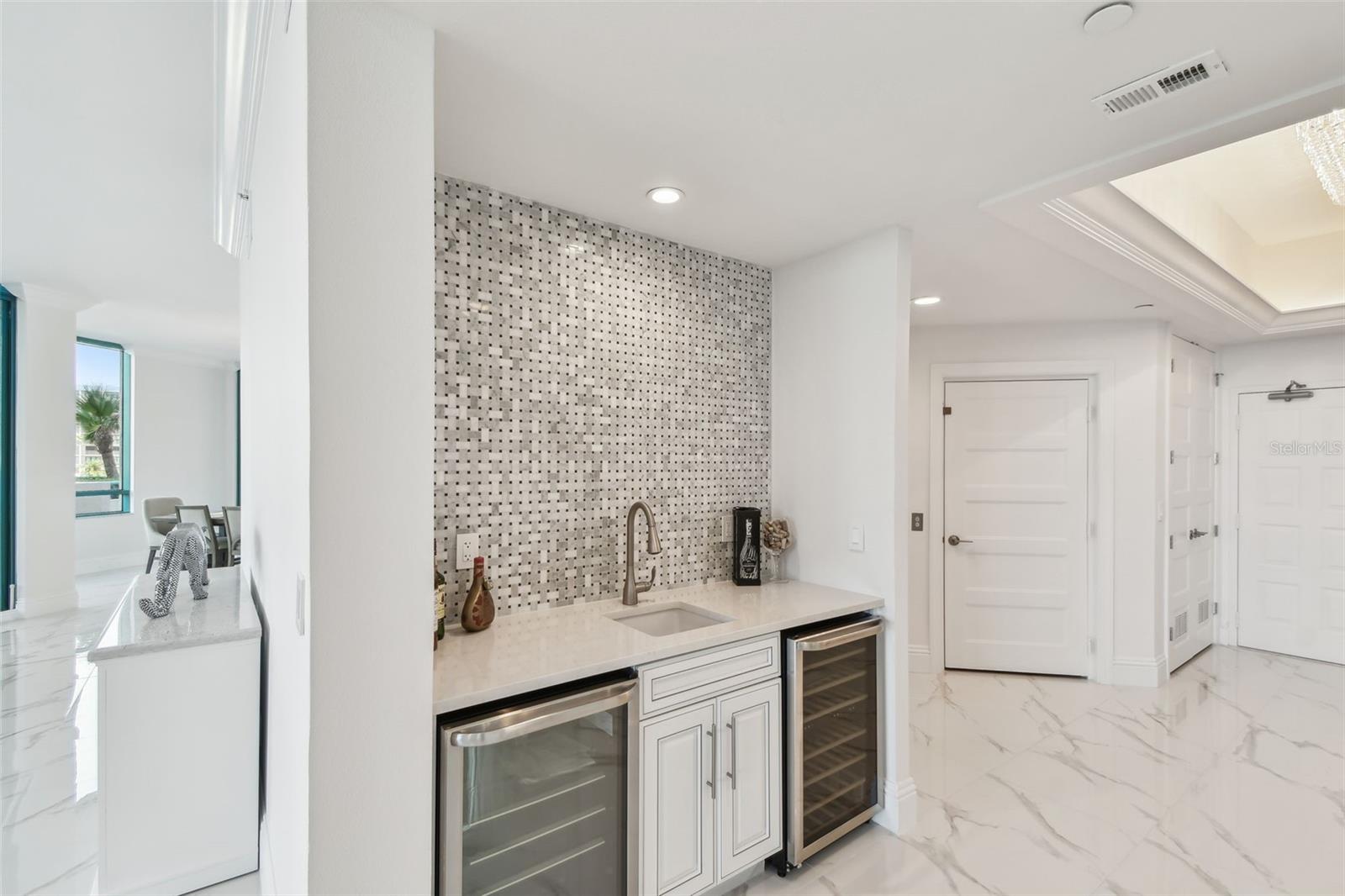 Foyer-Wet bar with wine fridge, sink & beverage fridge