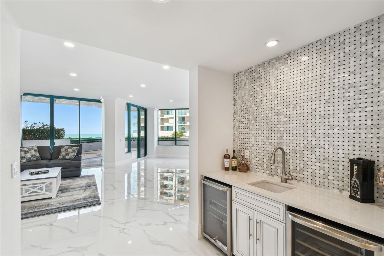 Foyer-Wet bar with wine fridge, sink & beverage fridge