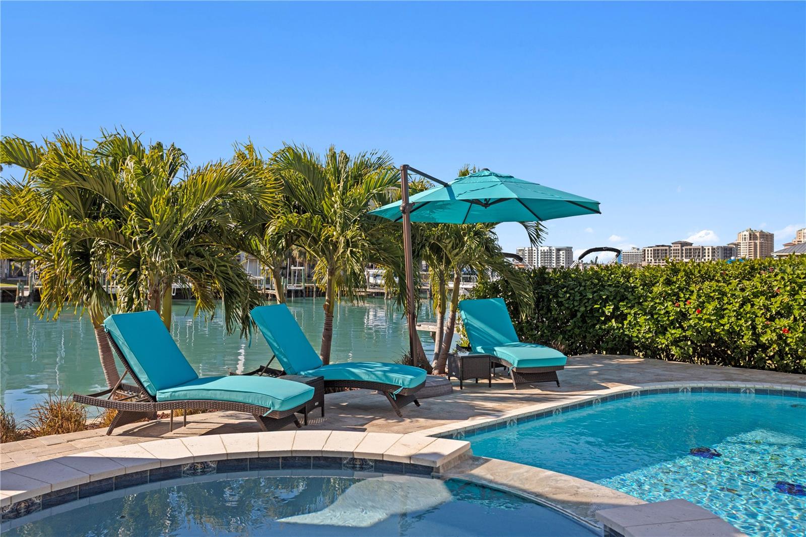 Heated pool and lush landscaping
