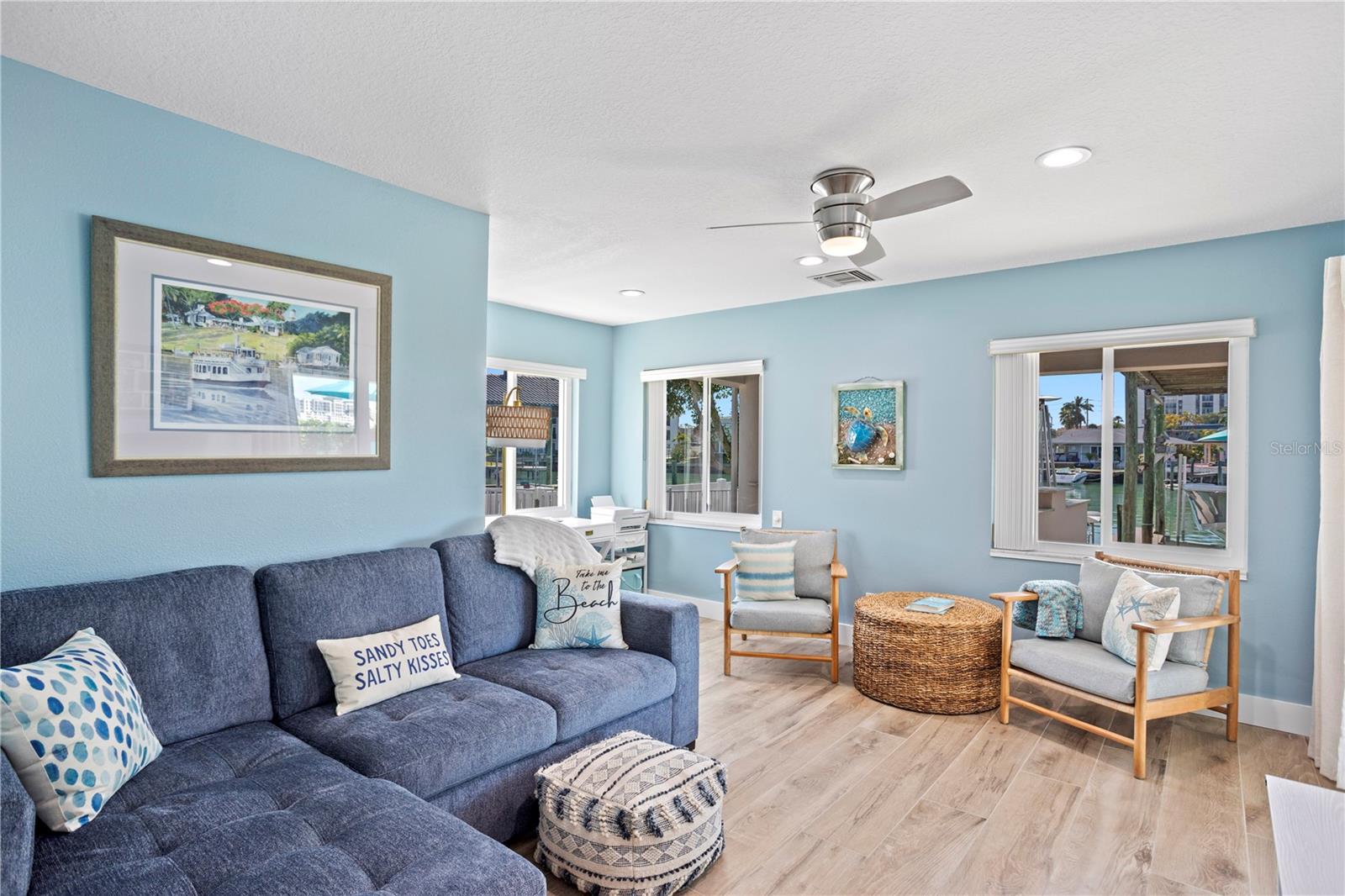 Guest bedroom with water view and patio access