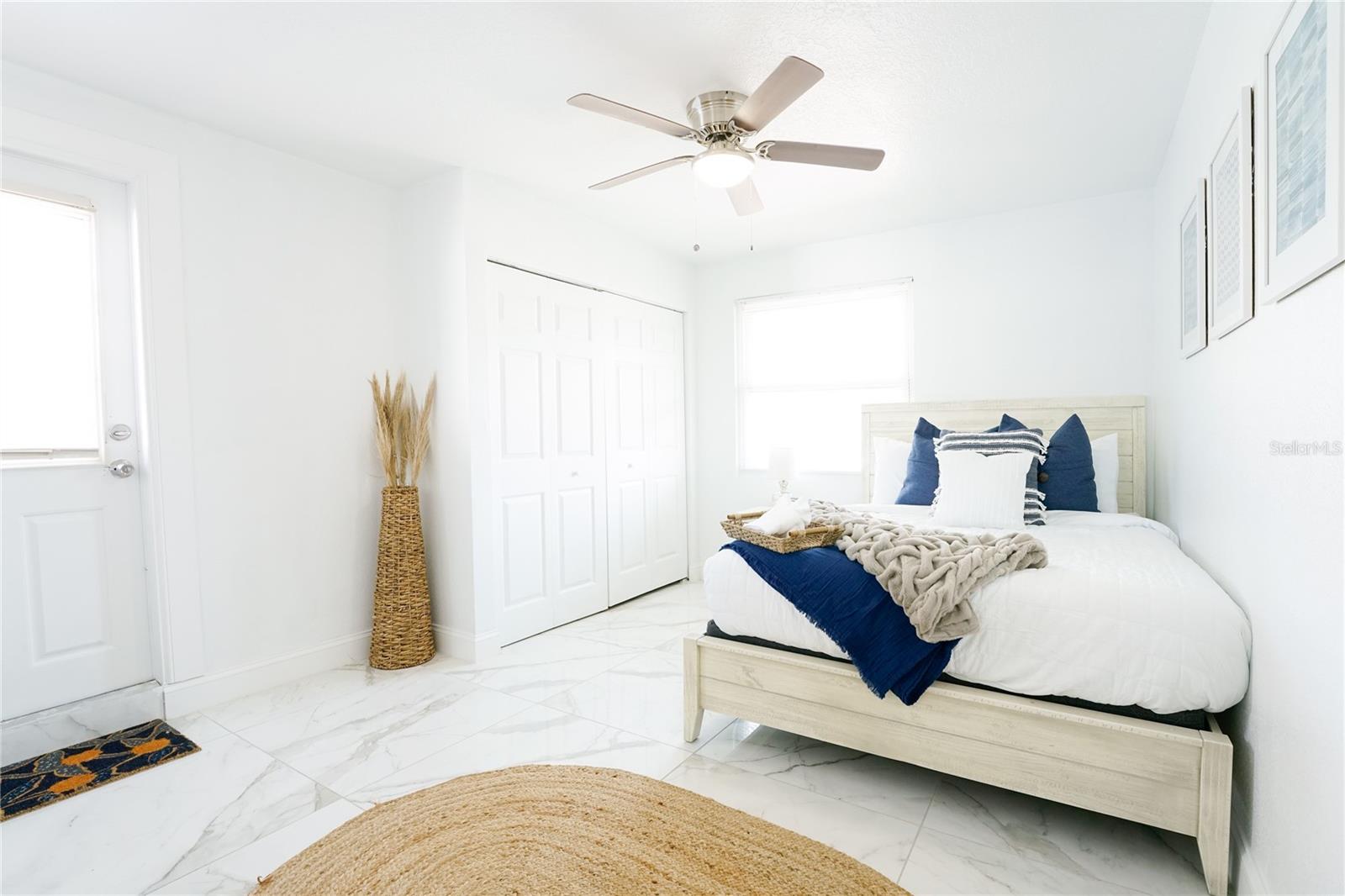 Comfortable primary suite offering privacy and generous space for rest and relaxation.