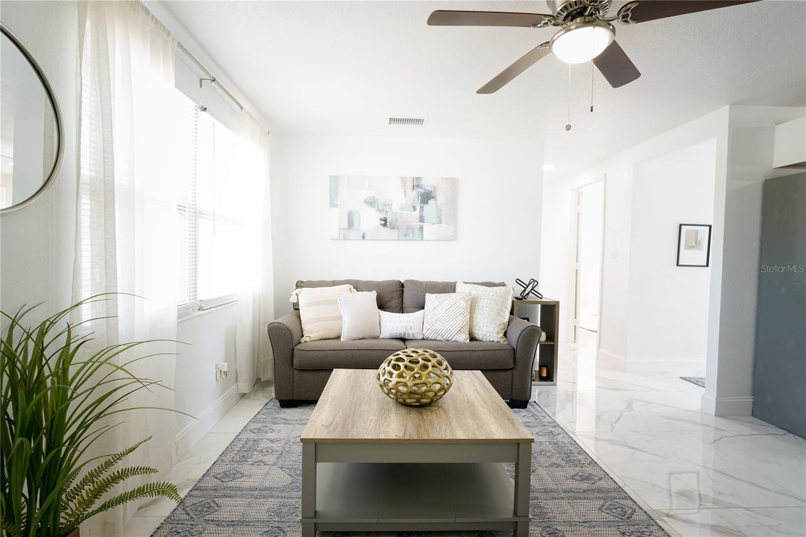 Bright and inviting living space with an open layout, ideal for relaxing or entertaining guests.